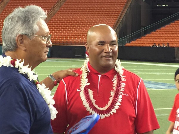 Saint Louis coach Cal Lee and Faga‘itua coach Suaese "Pooch" Ta‘ase spent several minutes talking after Friday's game at Aloha Stadium. 