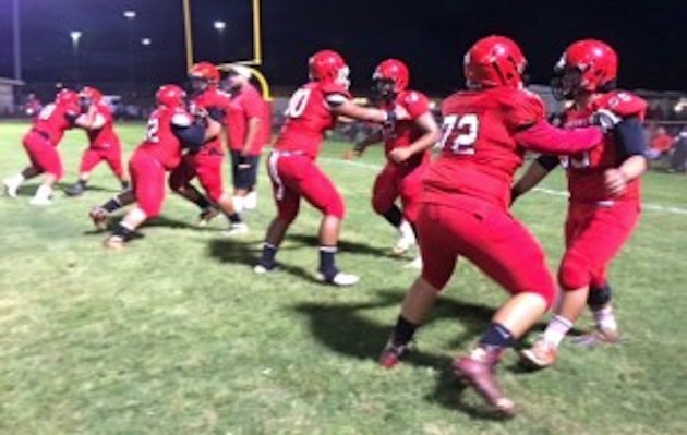 Kahuku prepares for battle against McKinley. Photo by Bruce Asato/Star-Advertiser.