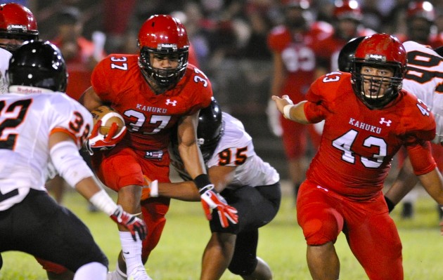 Sefa Ameperosa took advantage of this large hole made by the Kahuku offensive line in the Red Raiders' 50-0 win over Campbell on Friday night. Bruce Asato / Honolulu Star-Advertiser.