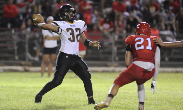 McKinley's Nelson Pita threw a pass in a 78-0 loss to Kahuku on Aug. 28. The Tigers administration made a final decision Monday to end its varsity season due to safety concerns caused by a roster diminished by injuries. / Bruce Asato / Honolulu Star-Advertiser.