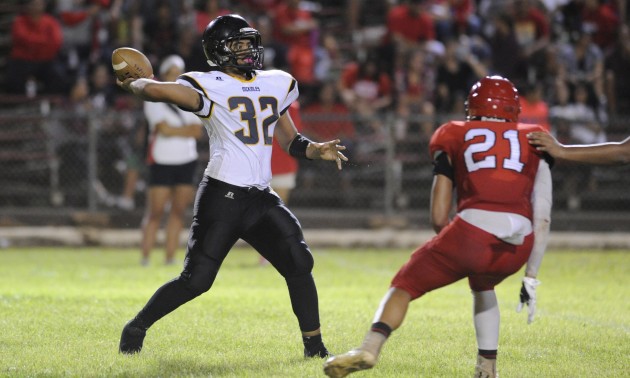 Nelson Pita was pressured all night long by Kahuku defenders and was sacked eight times. Bruce Asato / Honolulu Star-Advertiser.