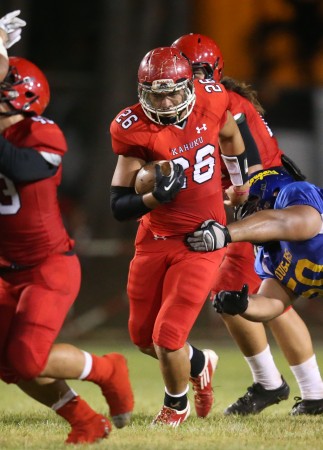 Kahuku's Kesi Ah-Hoy, a quarterback and running back, is pictured running against Kaiser on Aug. 21. The Red Raiders, despite a 78-0 win over McKinley on Friday, dropped 77 spots in the MaxPreps national rankings to No. 204. Mililani is Hawaii's top-ranked team nationally – at No. 10. Darryl Oumi / Special to the Star-Advertiser.