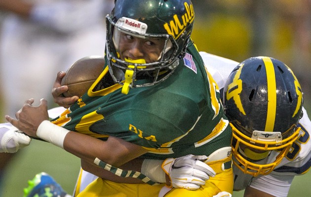 Punahou defensive lineman Jack-Eli Tufono tackled Leilehua's Anthony Ugalino during Friday's game at Hugh Yoshida Stadium in Wahiawa. The Bufanblu beat the Mules 49-7, and Ugalino scored Leilehua's only touchdown. It was one of 17 games statewide in weekend No. 1 of the 2015 football season. Cindy Ellen Russell / Honolulu Star-Advertiser.