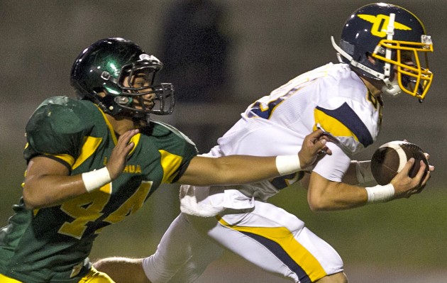 Punahou and Leilehua are scheduled to play in the first week of the football preseason in August. In photo from a 2015 game, the Buffanblu's Judd Cockett caught a touchdown pass with Bryson Caminos Kekahuna defending.