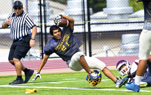 Ethan Takeyama  (21)  lunging forward over the goal line for a TD against Farrington even though his helmet was ripped off during the play.  The flag was accidentally dropped.  PHOTO BY DENNIS ODA.  AUG. 1, 2015