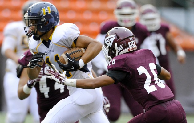 Farrington's Joey Maae (44) and Kody Leiu converged on dangerous Waipahu receiver Andrew Simanu during Saturday's game at Aloha Stadium. The Governors won 46-6. Simanu had seven catches for 114 yards for the Marauders. Bruce Asato / Honolulu Star-Advertiser.
