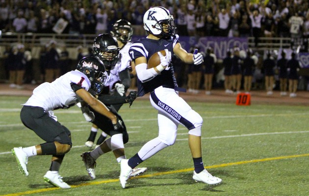 Kamehameha's Kumoku Noa caught a touchdown pass from quarterback Justice Young on Friday in a 63-21 win over ‘Iolani. It was one of 20 games in Week 8 in Hawaii high school football. Jay Metzger / Special to the Star-Advertiser.