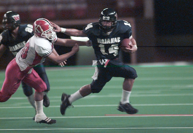 Waianae's Peter Sarono tried to get away from a Kahuku defensive player in a game played on Sept. 22, 2000. Star-Bulletin photo by Craig T. Koima.