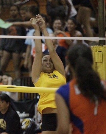 McKinley's Mariah Makuakane made a nice run to get to the ball and pop it up against Kalaheo on Wednesday night, but she was a lot closer to the taught rope near the end of the volleyball net than she tought and collided with it. She hit the ground hard, but was OK afterward. Krystle Marcellus / Honolulu Star-Advertiser.