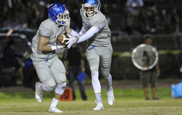 Outgoing Moanalua head coach Jason Cauley will miss Hawaii and most of all he'll miss the roster of players he learned he could count on, including back/slotback Michael Feliciano and quarterback Alakai Yuen. Bruce Asato / Honolulu Star-Advertiser.