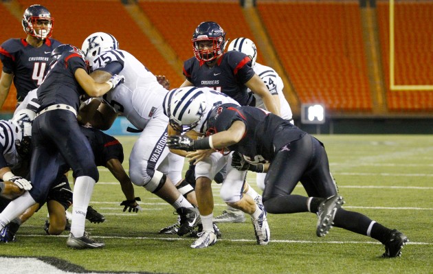 Toilolo leveled Yam in the end zone after Yam scored on a 1-yard run. George F. Lee / Honolulu Star-Advertiser.
