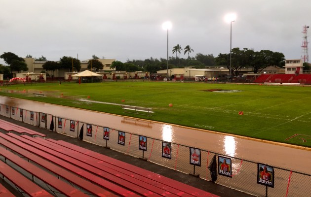 Kahuku's field was surrounded by a moat on Friday night, forcing the JV game to be postponed. The Red Raiders and Knights will pick up where they left off on Saturday at 4 p.m. with the varsity game to follow. Jason Kaneshiro / Honolulu Star-Advertiser