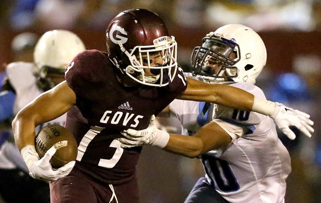 Farrington's Challen Faamatau (13) tries to get free from Kailua's Marlo Lagazo (10) during the third quarter on Saturday at Ticky Vasconcellos Stadium. Jay Metzger/Special to Star-Advertiser