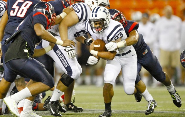 Kamehameha's Jordan Bayduan found a hole in Saint Louis' defense during Saturday's game at Aloha Stadium. The fifth-ranked Warriors dropped an intense 31-27 decision to the top-ranked Crusaders. George F. Lee / Honolulu Star-Advertiser.
