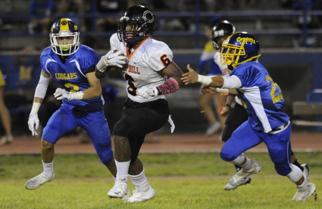 Terell Johnson, who has been banged up with injuries this year, had a big game in Campbell's 27-21 upset of Kaiser in the first round of the OIA Division I playoffs on Saturday. The Sabers move on to play Farrington in the quarterfinals in a rematch of last season's OIA D-I third-place game won by Farrington. Bruce Asato / Honolulu Star-Advertiser.