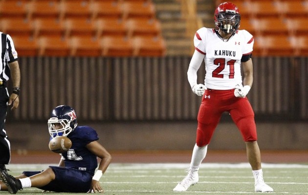 Kahuku's Hirkley Latu reacted after sacking Waianae quarterback Jaren Ulu during the Red Raiders 30-0 win on Saturday at Aloha Stadium. The Red Raiders (8-0) average 2.8 points allowed per game. Jamm Aquino / Honolulu Star-Advertiser.