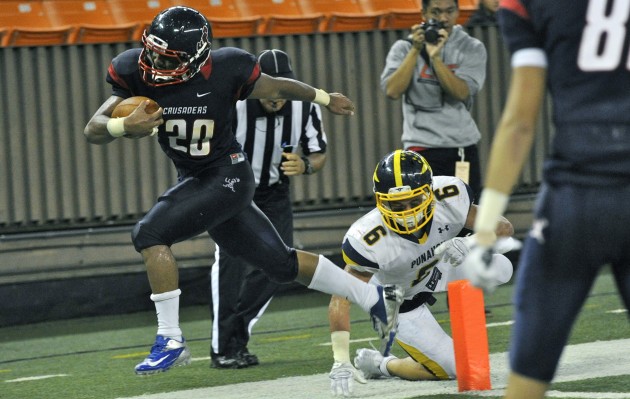 Saint Louis' Saitaua Lefau found the end zone in a 30-14 win over Punahou last Saturday, The Crusaders, No. 9 in the USA Today Pacific region rankings, play the Buffanblu again this Saturday for the ILH Division I championship and a spot in the state tournament. Bruce Asato / Honolulu Star-Advertiser.