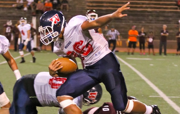 Kana‘i Mauga of Waianae eludes a Farrington tackler during the OIA third-place game at Mililani's John Kauinana Stadium. Daryl Oumi/Special to Star-Advertiser