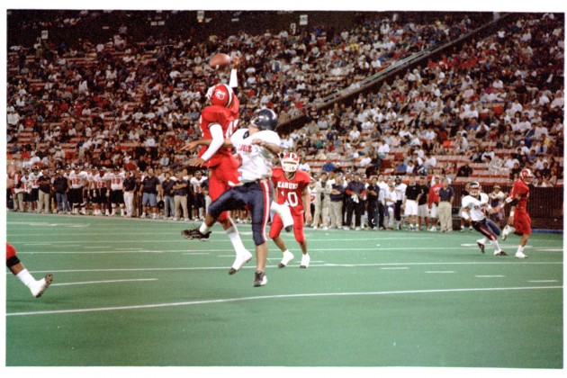 Kahuku defensive back, Leonard Peters, robbed St. Louis receiver Gerald Welch of a touchdown. Photo by Barry Markowitz.
