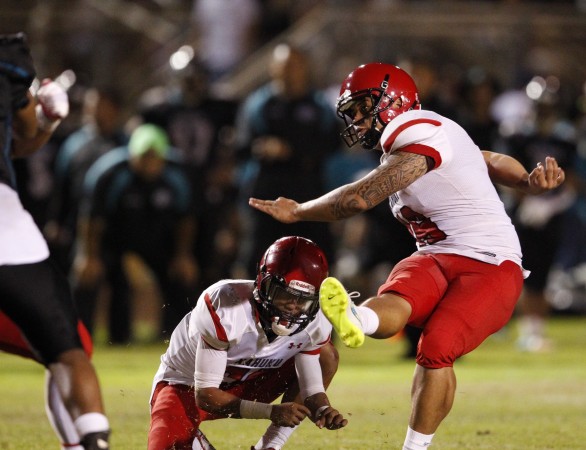 Kekoa Sasaoka, the Kahuku kicker, is shown during a game earlier this season. One of Sasaoka's extra points in the Division I championship game victory over Saint Louis on Friday appears to have gone wide right. Jamm Aquino / Honolulu Star-Advertiser.