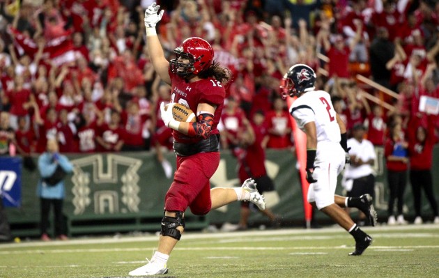 Kahuku will play natinoal powerhouse Bishop Gorman in Las Vegas in September. In photo, Pua Falemalu celebrated his touchdown late in the first half against Saint Louis in a 39-14 Division I championship game win over Saint Louis in November. Jamm Aquino / Honolulu Star-Advertiser.