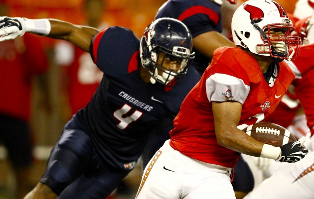 Fagaitua's Gus Poyer (2) gets away from St. Louis' Jordan Iosefa (4) during the first half of a high school football game between the St. Louis Crusaders and the Fagaitua Vikings on Friday, August 21, 2015 at Aloha Stadium in Halawa. Jamm Aquino/Star-Advertiser