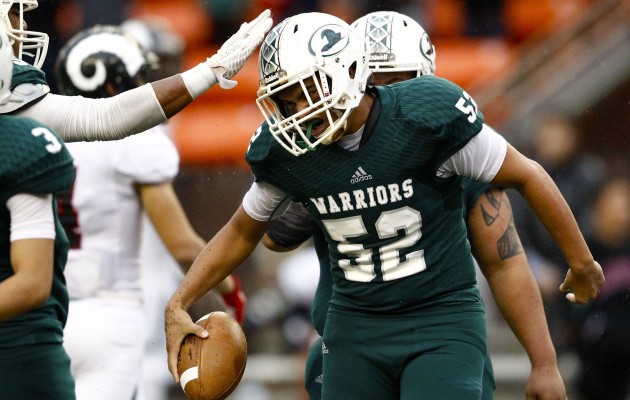 Kapaa's Jonathan Bilyeu celebrated after recovering a Radford fumble in the state Division II championship game last season. Of all Neighbor Island football teams a year ago, the Warriors went the farthest in the postseason. Jamm Aquino / Honolulu Star-Advertiser.