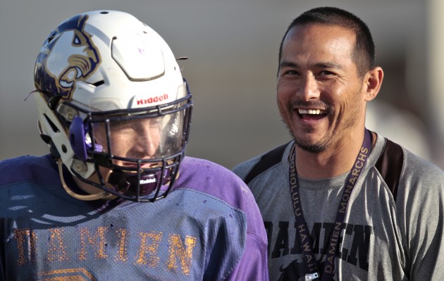 Damien coach Eddie Klaneski and linebacker Shawn Borges shared a light-hearted moment at practice on Wedneday. The Monarchs visit Konawaena for a first-round Division II state-tournament game on Saturday. Jamm Aquino / Honolulu Star-Advertiser.
