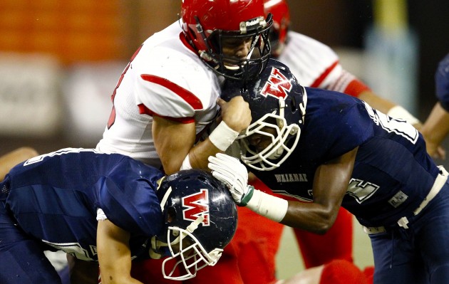 How many yards will Theodore Kenese and Kahuku run for tonight? Jamm Aquino / Star-Advertiser