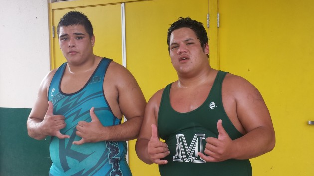 Kapolei's Donte Keliiholokai, left, renewed his friendship with Molokai's Kui Han on Friday. Then, on Saturday, the two went at it in the 285-pound division at the Hawaii Wrestling Officials Association Scholarship Tournament at the Leilehua gym. Nick Abramo / Honolulu Star-Advertiser.
