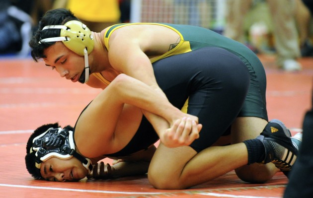Leilehua's Liam Corbett won his Hawaii Wrestling Officials Association Scholarship Tournament quarterfinal match over Mililani's Paxton Horiuchi on Friday. Corbett is No. 1 in the Honolulu Star-Advertiser's boys pound for pound rankings.  The Leilehua iboys are in seventh place going into the tournament's second of two days. Bruce Asato / Honolulu Star-Advertiser.