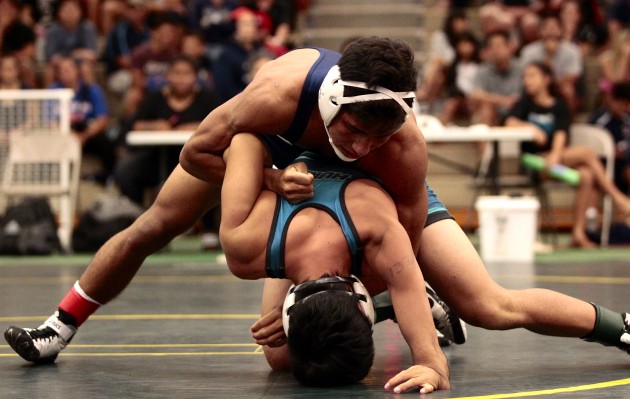 Kamehameha's Blaysen Terukina is shown wrestling against Kapolei's Shandon Ilaban-Totten at the Officials meet. They meet again in the state 132 final. Terukina won the first time 5-4. Jamm Aquino / Honolulu Star-Advertiser.
