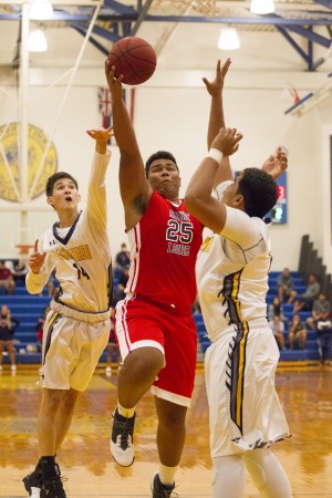 Saint Louis' Tristan Nichols drove to the basket in Wednesday's game against Punahou. The Crusaders are No. 1 in the Honolulu Star-Advertiser Top 10 this week. Cindy Ellen Russell / Honolulu Star-Advertiser.