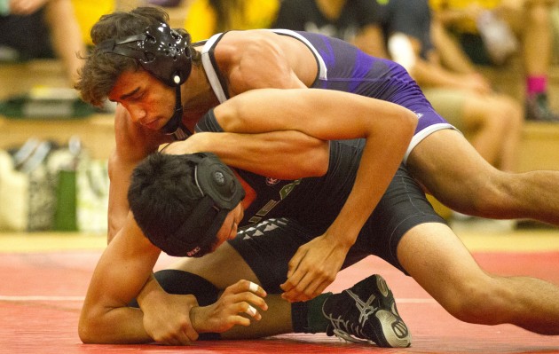 Pearl City's Baylen Cooper eventually won this match by pin against Aiea's Shaun Ildefonso in the 138-pound class Saturday in the Pearl City round-robin tournament. He is trying to uphold the Cooper legacy in Hawaii high school wrestling. Krystle Marcellus / Honolulu Star-Advertiser.