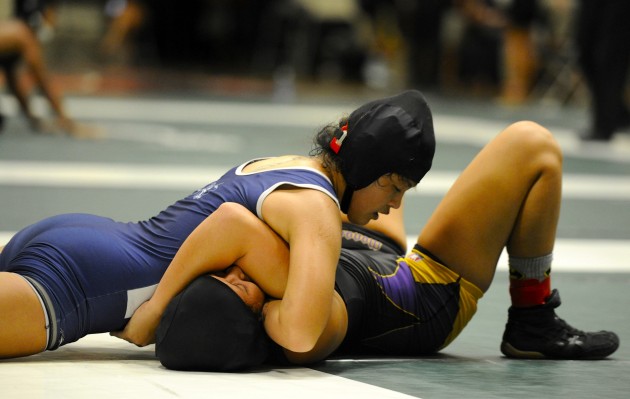 Pomaikai Yamaguchi moved up a weight class and pinned her friend, Tara Labanon of Damien, in the third period Friday. Bruce Asato / Honolulu Star-Advertiser.