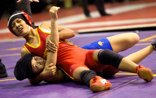 Roosevelt's 97-pound captain Menjam Tamang, top, has beaten defending 98-pound state champion Bailey Hoshino in the final of two tournaments twice this season. Honolulu Star-Advertiser photo.