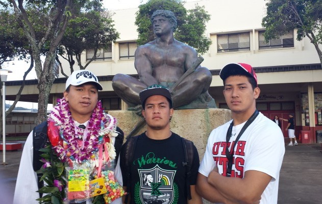 Kahuku's Hirkley Latu, Keala Santiago and Bradlee Anae signed letters of intent to their respective colleges on Wednesday. Nick Abramo / Honolulu Star-Advertiser.