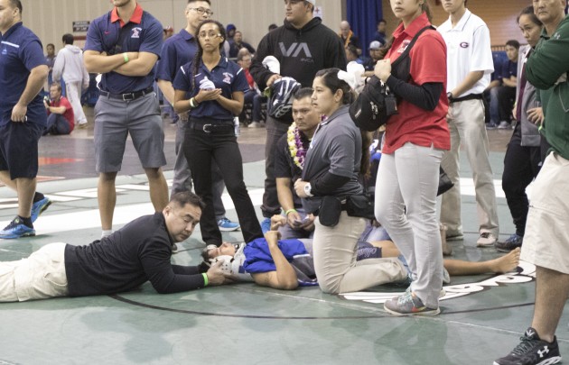 Moanalua's Caeleb Reyes suffered head and neck injuries against Zack Diamond and left the arena on a stretcher. Krystle Marcellus / Star-Advertiser