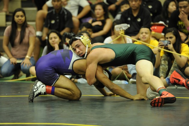 Leilehua's Liam Corbett wrestled Pearl City's Trevor Alvarado at 154 pounds in the OIA championships last week. Photo by Bruce Asato/Star-Advertiser.