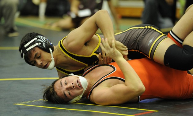 Mililani's Zack Diamond wrestled Campbell's Roy Gallarde at the OIA championships. Photo by Bruce Asato/Star-Advertiser.