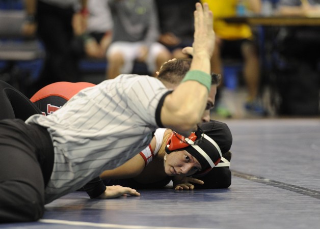 Lahainaluna's Alexia Encinas pinned Pearl City's Mikayla Abe to win the state title at 107 pounds in 2015. Photo by Bruce Asato/Star-Advertiser.