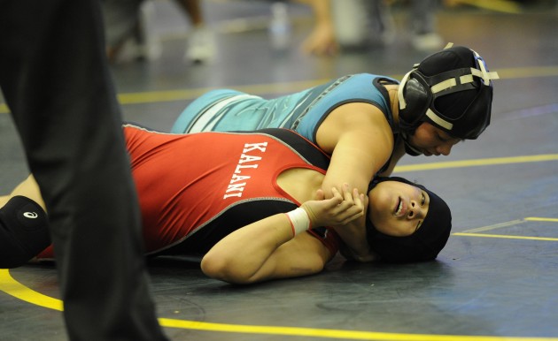 Kapolei's Allie Mahoe battled Czarina Pineda-Abaya at 119 pounds at the OIA Championships. Photo by Bruce Asato/Star-Advertiser.