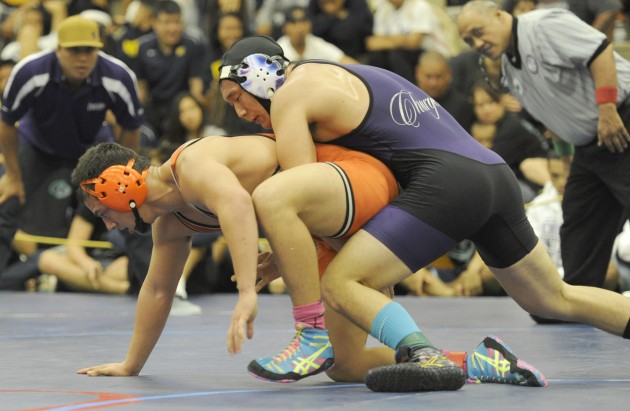 Campbell's Micah Tynanes, bottom, who finished third in states last year, is the top seed at 195 pounds. Photo by Bruce Asato/Star-Advertiser.