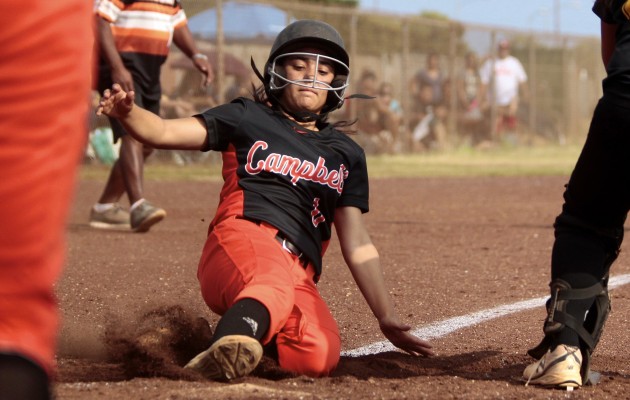 Campbell's Kiani Telles will be playing softball at Midland College in Texas next fall. Telles is shown sliding into home for a run against Mililani during the regular season. The Sabers went on to win the state title for the second year in a row. Jamm Aquino / Honolulu Star-Advertiser.