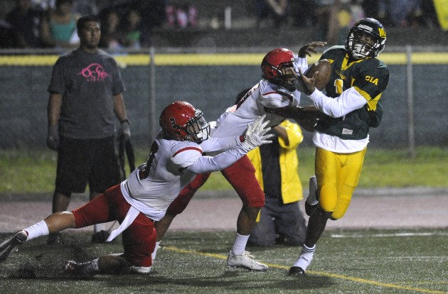 Leilehua's Charles Watson scored a touchdown on offense vs. Kahuku last season. Photo by Bruce Asato/Star-Advertiser.