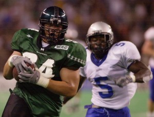 Abu Maafala ran into the end zone for a touchdown after an interception in a University of Hawaii football game against Eastern Illinois in 2002. Honolulu Star-Advertiser file photo.