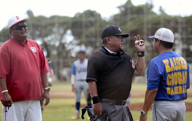 Kaiser head coach Ryan Umemoto was ejected by the umpire as Kalani coach Shannon Hirai looked on during an April 8 game. Jamm Aquino / Honolulu Star-Advertiser