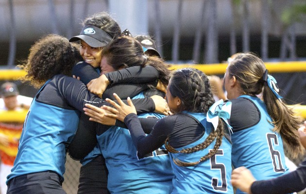 Pitcher Sadie Kapaku-You was mobbed by teammates after Kapolei beat Mililani 6-5 in the OIA championship game on April 28. Cindy Ellen Russell / Honolulu Star-Advertiser.