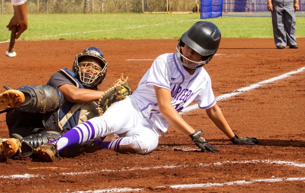 Moanalua catcher Raven Rosa-Lasco tagged out Pearl City's Kristin Frost at the plate to end the Chargers' eight-run first inning. Frost was trying to score on a wild pitch during Pearl City's 17-1 home victory in the first round of the OIA playoffs. Dennis Oda / Honolulu Star-Advertiser.