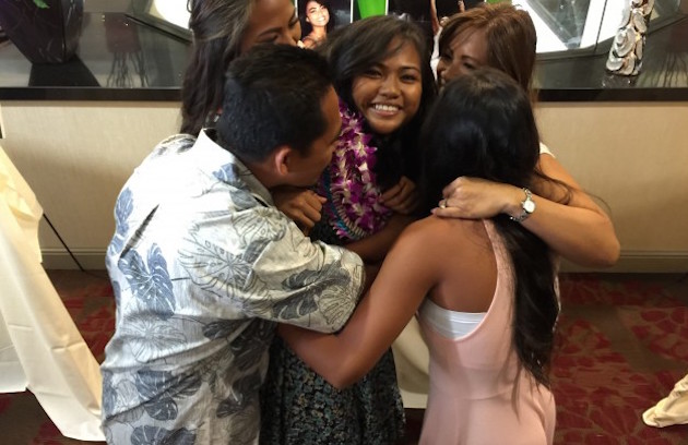 Chanelle Molina is group-hugged by her family prior to the Enterprise Hawaii Hall of Honor banquet. Photo by Paul Honda/Star-Advertiser.